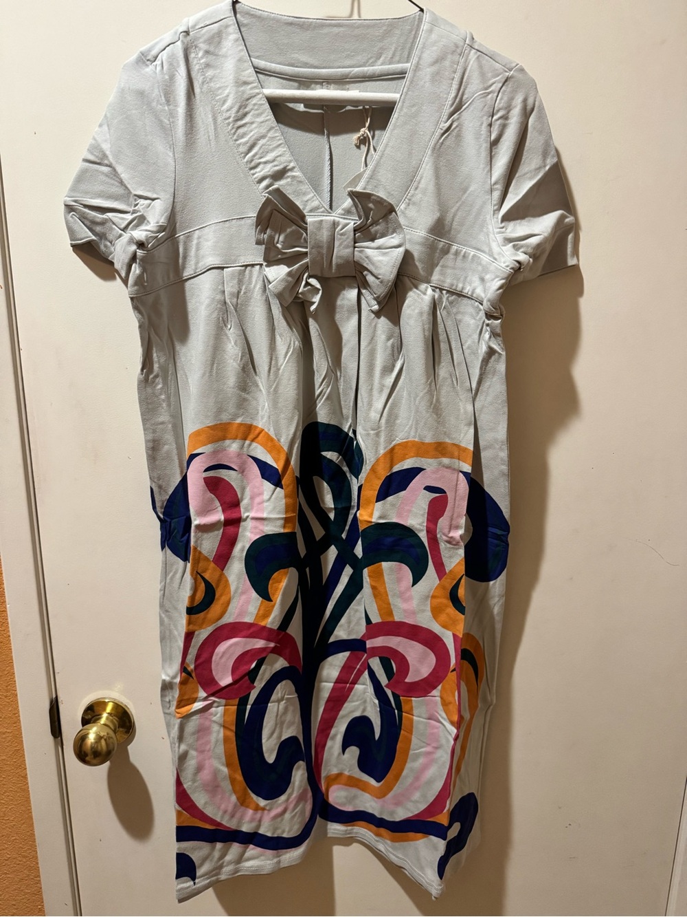 Dress with Colorful Abstract Print with bow New in package. Stretch for comfort